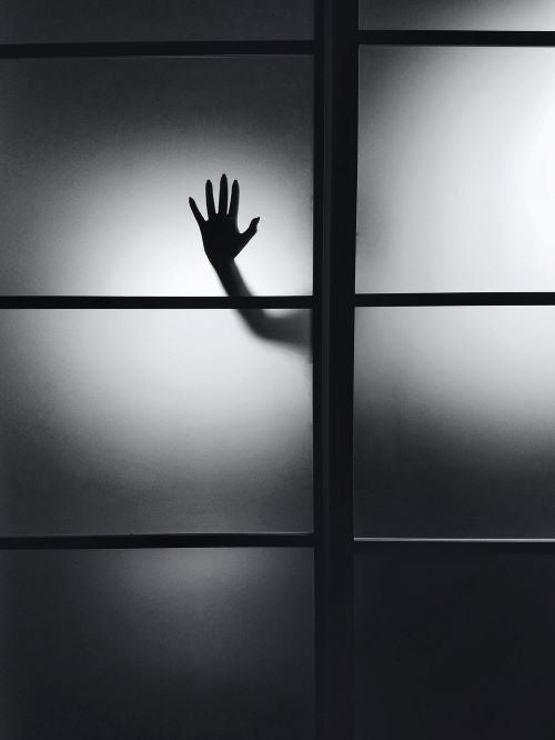 Scary Silhouetted Hand on Window