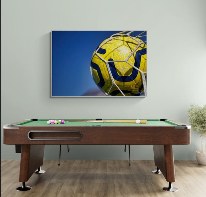 Yellow & Blue Soccer Ball in Net